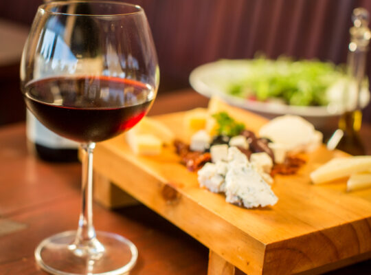 Cheese plate with a glass of red wine